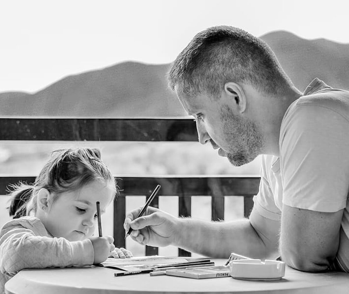 Dad teaching bible lessons to his daughter